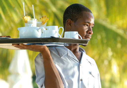 Photo of an elegantly dressed waiter.